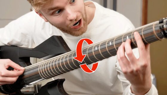 A man playing a spinning guitar